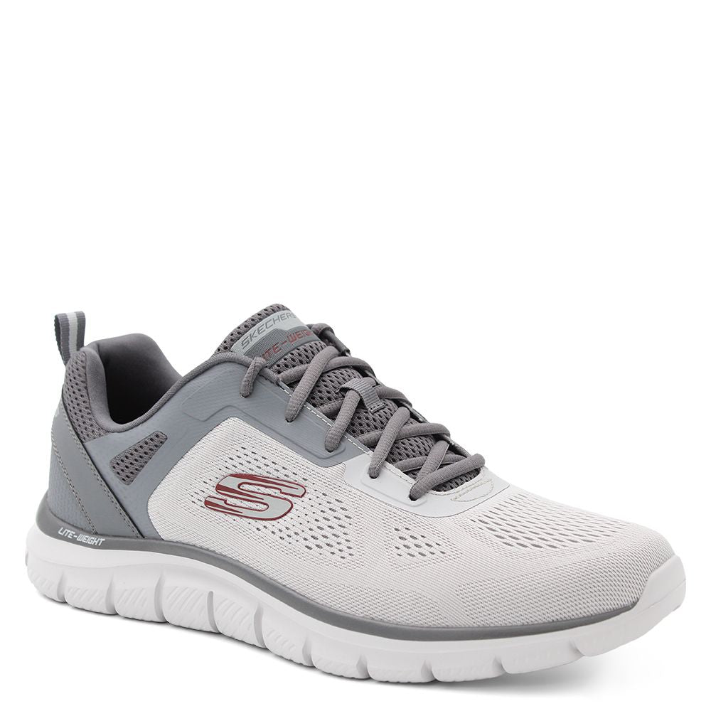 A pair of Skechers men's trainers with a mesh and synthetic upper in black and grey colors, featuring a Skechers logo detail on the side. Skechers Track Broader Mens Trainers
