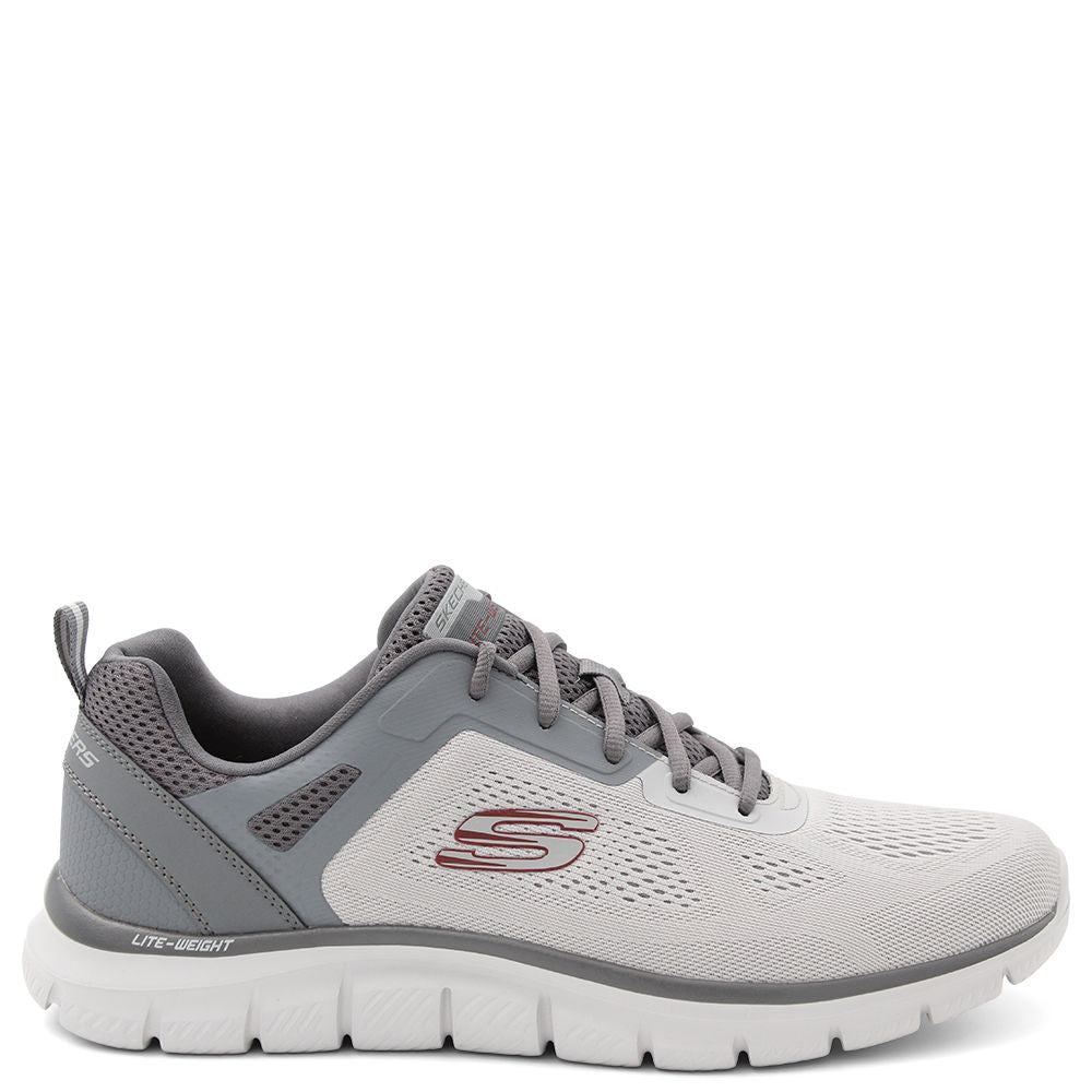 A pair of Skechers men's trainers with a mesh and synthetic upper in black and grey colors, featuring a Skechers logo detail on the side. Skechers Track Broader Mens Trainers