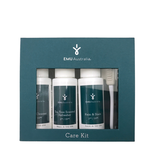 EMU Australia care kit with three bottles and a brush in a green box.
